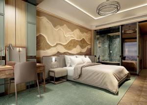 a bedroom with a large bed and a desk and a desk at La Passion Premium Cau Go in Hanoi