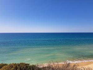a view of the ocean from a beach at וילה לגון in Netanya