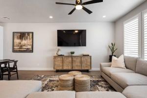 a living room with a couch and a ceiling fan at Desert Daydream townhouse in St. George