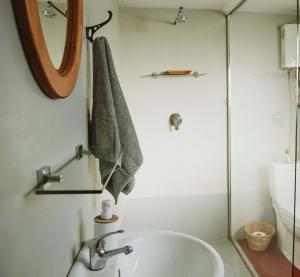 a bathroom with a tub and a mirror at Makongo Hills Lodge in Magudu