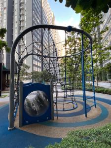 a playground with a slide in a city at The Heim in Kajang