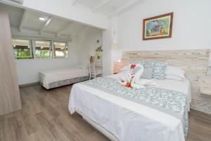a bedroom with two beds in a room at Romance Bungalows in Beau Vallon
