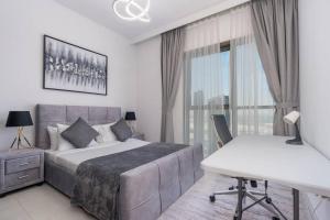 Postel nebo postele na pokoji v ubytování Luxury 2bedroom Dubai Creek Balcony & Views + 31 fotografií
