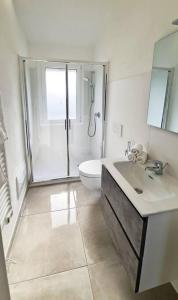 a bathroom with a shower and a sink and a toilet at Villa Bettina in Sarroch +16 photos