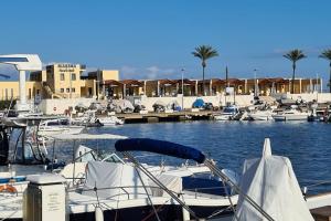 a group of boats docked in a marina at Villa Bettina in Sarroch