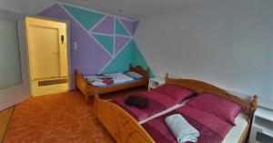 Postel nebo postele na pokoji v ubytování Ferienwohnung Vido - Nordhalben