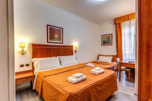 Postel nebo postele na pokoji v ubytování Baltik Guesthouse