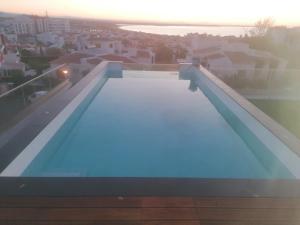 a swimming pool on the roof of a building at Sensations Guesthouse in Lagos