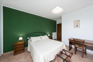 Postel nebo postele na pokoji v ubytování Agriturismo Daniela
