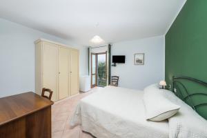 Postel nebo postele na pokoji v ubytování Agriturismo Daniela