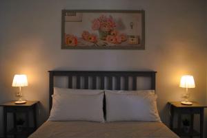 Letto o letti in una camera di A casa dei nonni B&B