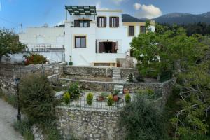 a house on top of a stone wall at DIMIS ASOMATOS HOMES in Kos