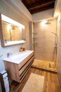 a bathroom with a sink and a shower at DIMIS ASOMATOS HOMES in Kos