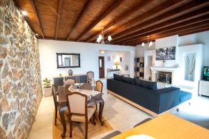 a living room with a table and a couch at DIMIS ASOMATOS HOMES in Kos
