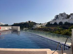 a swimming pool on the roof of a building at Luxurious in nature in Málaga