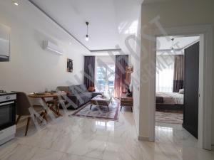 Et opholdsområde på Calypso Residence Luxurious Beachside Apartment in Alanya D6