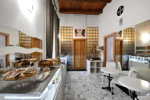 a kitchen with a counter with food on it at Il Fascino Di Roma in Rome