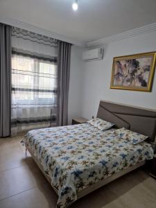 a bedroom with a bed and a window at Palm lake resort Folla Monastir in Monastir