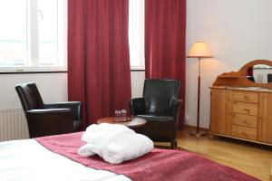 Cama o camas de una habitación en First Hotel Jörgen Kock