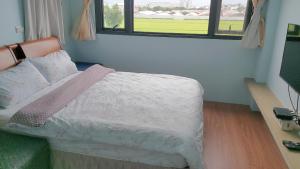 Postel nebo postele na pokoji v ubytování Chin-Lan B&B