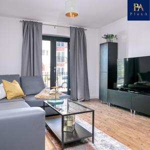 a living room with a couch and a glass table at Peaceful Serviced Apartment - Pluxa The Zen in Birmingham