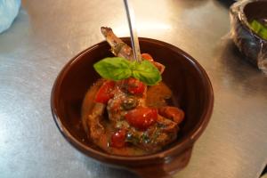 a bowl of food with a green leaf on top at Hotel Albatros in Ischia