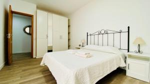 Postel nebo postele na pokoji v ubytování Suite Dream Capricho
