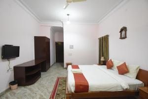 Voodi või voodid majutusasutuse Satyam Palace Resort toas
