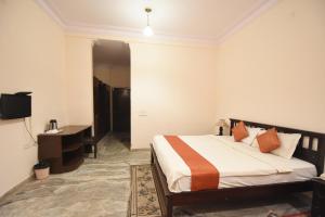 Voodi või voodid majutusasutuse Satyam Palace Resort toas