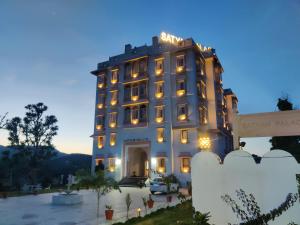 a building with lights on top of it at Satyam Palace- Heritage Luxury Resort in Pushkar