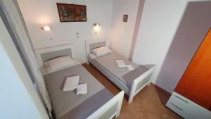 Postel nebo postele na pokoji v ubytování ASTORIA lindos