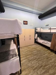 Postel nebo postele na pokoji v ubytování Tbil Home Hostel + 21 fotografií
