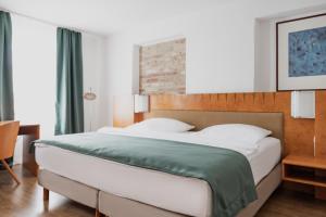 Postel nebo postele na pokoji v ubytování Hotel Cristallo