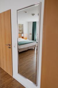 Postel nebo postele na pokoji v ubytování Hotel Cristallo