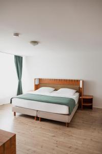 Postel nebo postele na pokoji v ubytování Hotel Cristallo + 13 fotografií
