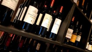 a bunch of bottles of wine sitting on shelves at Hotel De Golf in Bredene