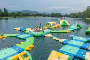 a group of inflatablelatable rides in a lake at Barbazan comminges in Barbazan