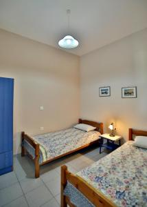 Letto o letti in una camera di Pavlidis