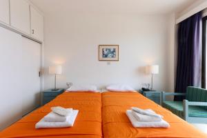 Postel nebo postele na pokoji v ubytování Axiothea Hotel