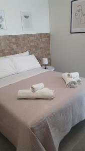 Кровать или кровати в номере Casa di Monique 1