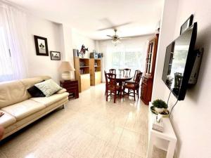 a living room with a couch and a table at Three bedroom apartment, PRIME Javea location in Jávea
