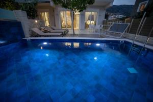 a swimming pool in a villa at night at Thomas House Hersonissos - Private Pool - Sleeps 6 in Hersonissos