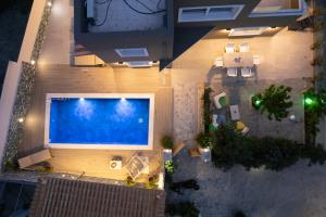 an overhead view of a swimming pool in a building at Thomas Villa Hersonissos - Private Pool - Sleeps 7 in Hersonissos