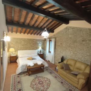 Ένα ή περισσότερα κρεβάτια σε δωμάτιο στο Il casale del Domo