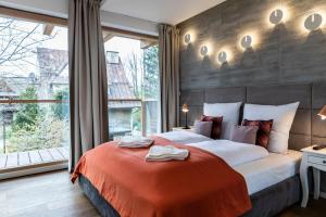 Posteľ alebo postele v izbe v ubytovaní Apartamenty Pod Giewontem Lux&Spa Zakopane