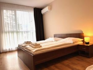 Postel nebo postele na pokoji v ubytování Hotel Aréna