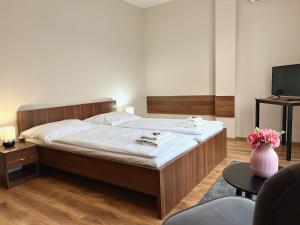 Postel nebo postele na pokoji v ubytování Hotel Aréna