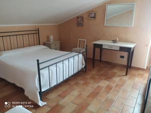 Postel nebo postele na pokoji v ubytování L'Uliveto