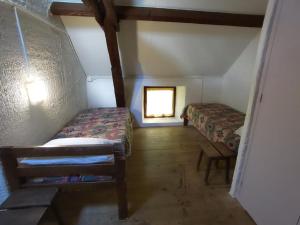 Кровать или кровати в номере Bienvenue en Transition 48 - Le Cros