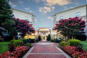 a building with flowers in front of it at TownePlace Suites by Marriott Springfield in Springfield